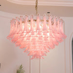 Ombeline Tiered Pink Glass Chandelier | Pink Glass and Brass | Bottom-up perspective of the illuminated chandelier against a ceiling | Severn Lighting