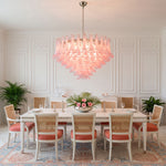 Ombeline Tiered Pink Glass Chandelier | Pink Glass and Brass | Illuminating an elegant dining room above a long wooden table | Severn Lighting