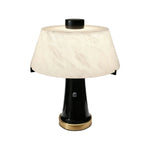 Orsino Alabaster Trapezoid Table Lamp | Natural Alabaster, Black Metal and Brass | Front full view on a pure white background, illuminated | Severn Lighting