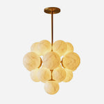 Ottoline Alabaster Cluster Chandelier | Natural Alabaster and Brass | Full product front shot on a white background showing a cluster of glowing spherical stone globes | Severn Lighting