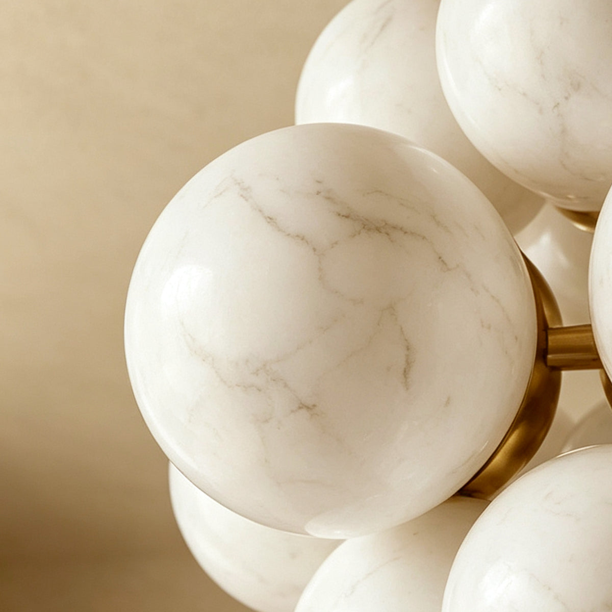 Ottoline Alabaster Cluster Chandelier | Natural Alabaster and Brass | Macro close-up shot focusing on the smooth texture and natural marble veining of an individual orb | Severn Lighting