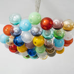 Rainbow Glass Bubble Cluster Chandelier | Multi-colored Blown Glass and Metal Cords | Product display showing the unlit colorful cluster hanging against a plain light grey studio background | Severn Lighting