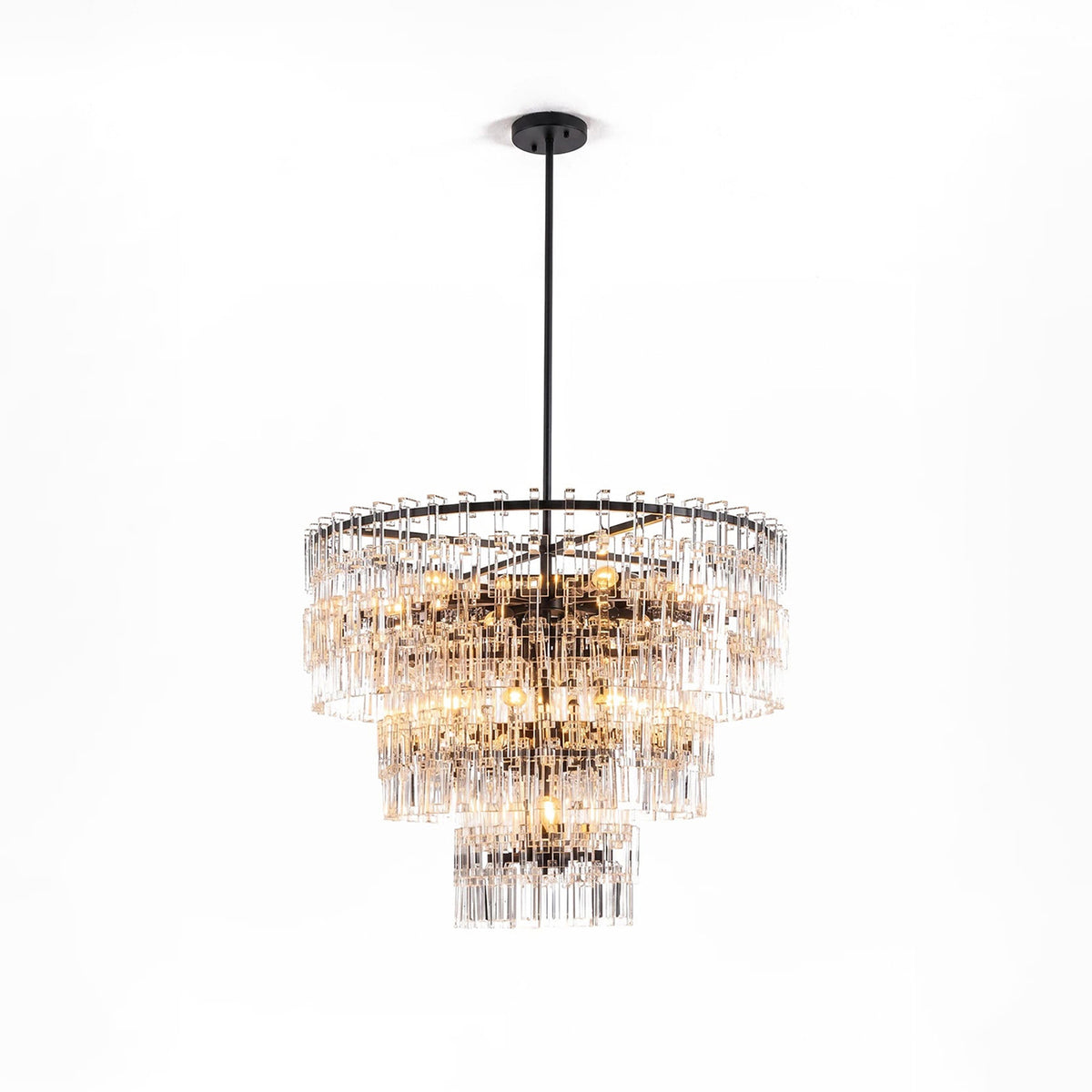 Rainer Cascading Glass Rod Chandelier | Clear Glass and Brass | Brass frame option illuminated on a plain white background | Severn Lighting