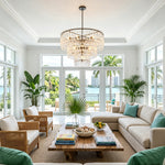 Rainer Cascading Glass Rod Chandelier | Clear Glass and Black Metal | Illuminating a spacious coastal lounge with wicker armchairs | Severn Lighting