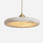 Sabine Alabaster Disc Pendant Light | Natural Alabaster and Brass | Slightly angled full view illuminated on a plain white background | Severn Lighting