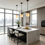 Sabine Alabaster Drum Pendant Light | Natural Alabaster and Brass | A row of three pendants lighting up a contemporary marble kitchen island with high-rise views | Severn Lighting