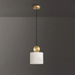 Sabine Alabaster Drum Pendant Light | Natural Alabaster and Brass | Standard studio single product view hanging unlit against a solid dark grey minimalist background | Severn Lighting
