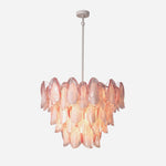 Seraphina Rose Glass Petal Chandelier | Glass, Metal | Fully illuminated tiered luxury chandelier featuring cascading rose pink glass petal panels on a clean white metal rod frame | Isolated studio shot | Severn Lighting