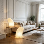 Severine Spiral Washi Paper Table Lamp | Washi Paper and Metal | Standing on the floor next to a sofa in a bright living room | Severn Lighting