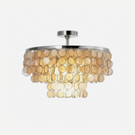 Sirena Capiz Disc Tiered Ceiling Light | Shell, Metal | Multi-tiered semi-flush mount ceiling light with cascading translucent capiz shell discs and chrome metal accents | Isolated lit product shot on white background | Samu Lamp