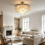 Sirena Capiz Disc Tiered Ceiling Light | Shell, Metal | Illuminating a sophisticated bright living room featuring a classic fireplace and comfortable cream sofas | Samu Lamp