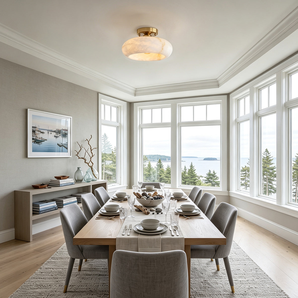 Solaine Alabaster Dome Ceiling Light | Natural Alabaster and Brass | Illuminating an elegant dining room with a long wooden table | Severn Lighting