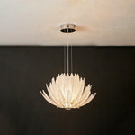 Solaris Agave Glass Starburst Chandelier | White Textured Glass | Hanging fully lit white glass version on slim wires against a dramatic dark grey background | Severn Lighting
