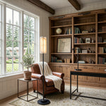 Stellan Alabaster Column Floor Lamp | Natural Alabaster, Brass and Black Metal | Positioned in a warm study room beside a leather armchair | Severn Lighting