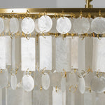 Thalassa Tiered Capiz Shell Chandelier | Capiz Shell, Metal | Detailed close-up view highlighting the organic variations and translucent white texture of the hanging rectangular capiz panels | Detail shot | Severn Lighting