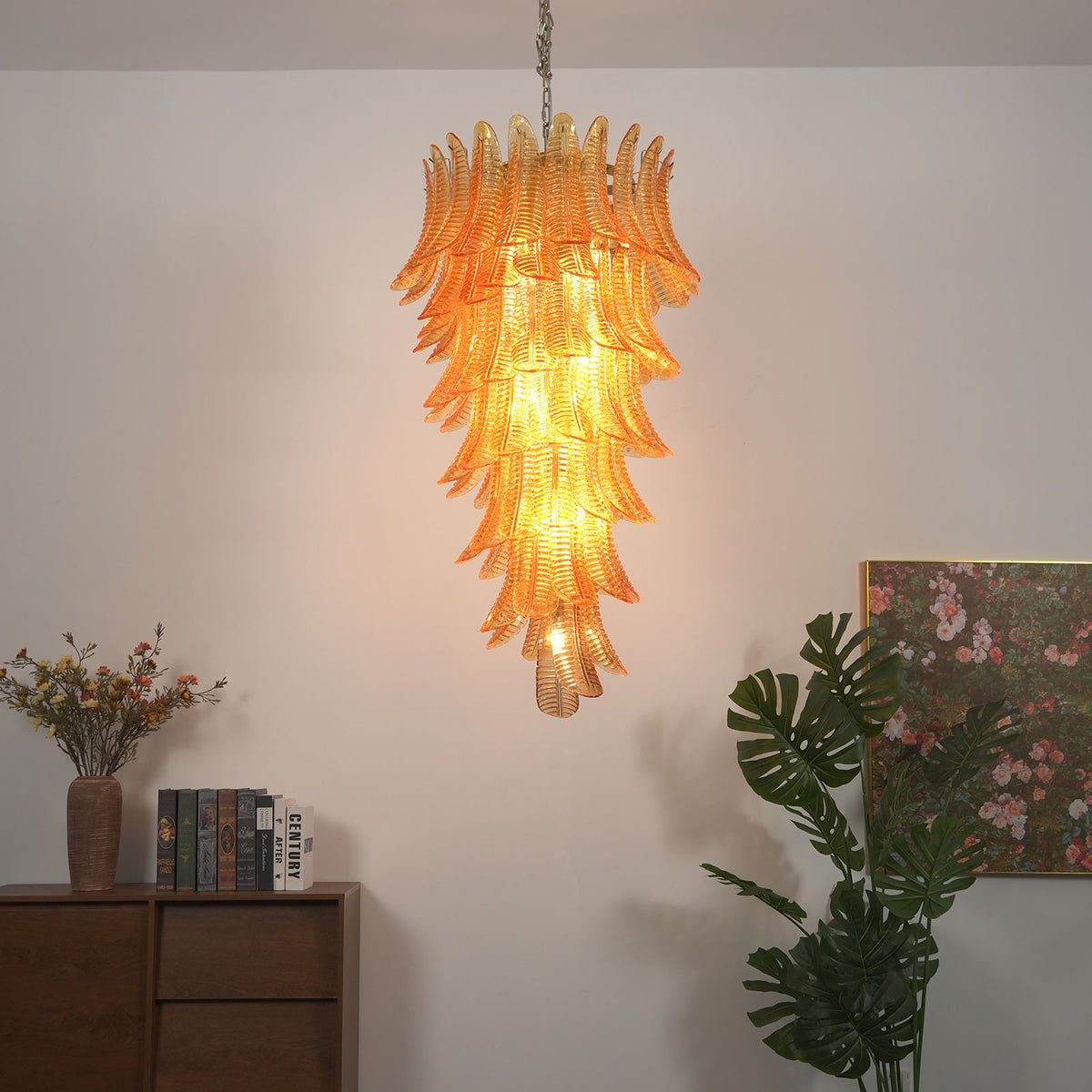 Thessaly Amber Glass Plume Chandelier | Amber Glass and Brass | Real-life room view hanging in a cozy corner with indoor plants | Severn Lighting