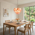 Vaucelle Swirled Glass Disc Tiered Chandelier | Swirled Glass and Brass | Displayed above a wooden dining table in a sunlit dining room | Severn Lighting