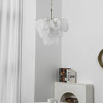 Vaucelle Swirled Glass Disc Tiered Chandelier | Swirled Glass and Brass | White glass disc variant hanging in a bright interior room | Severn Lighting