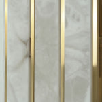 Veraune Bar Wall Sconce | Natural Carved Alabaster | Macro detail of mineral stone veining and brass bar | Severn Lighting
