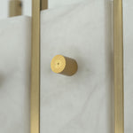 Veraune Bar Wall Sconce | Solid Brass Hardware | Macro close-up of knurled brass cap screw and stone slab | Severn Lighting