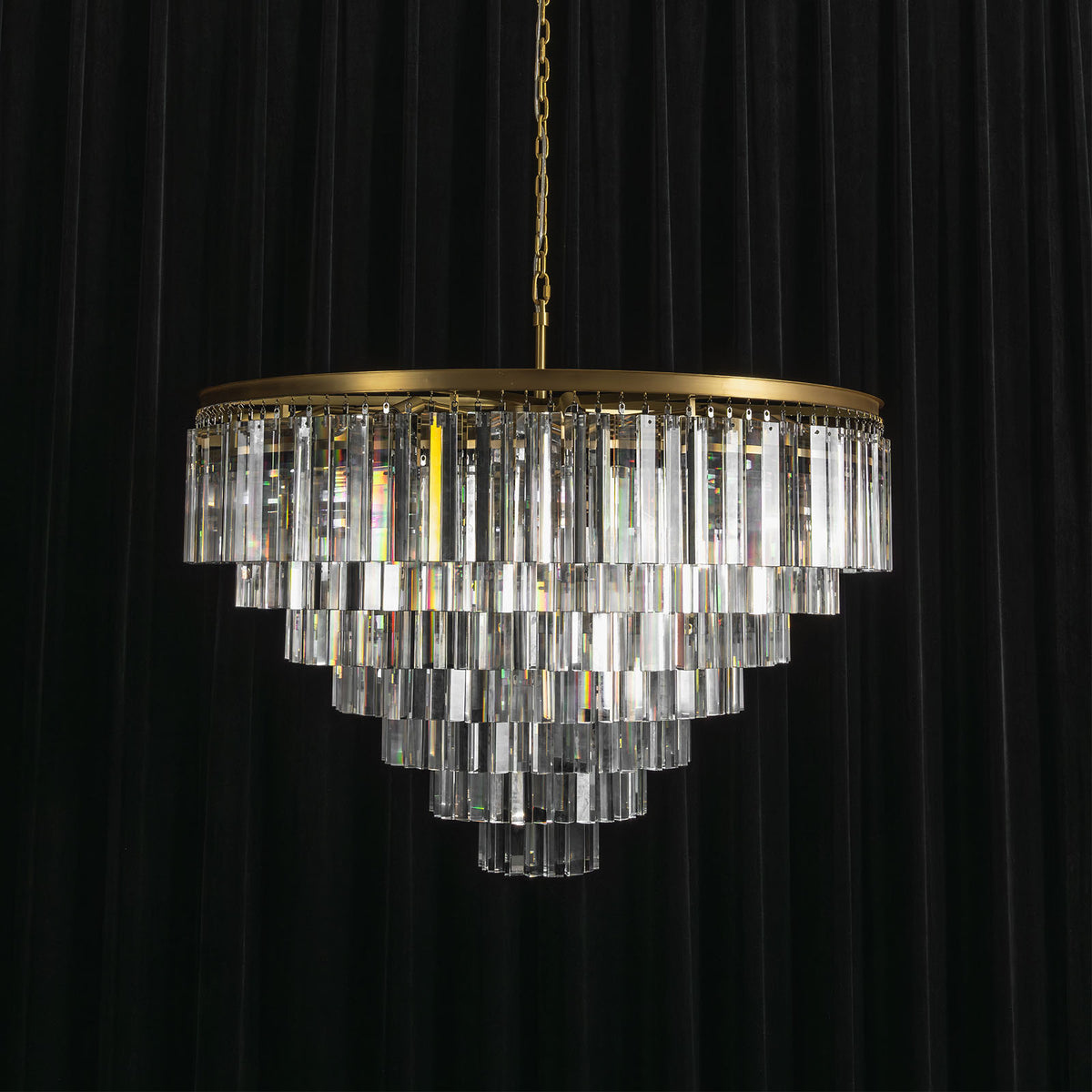 Verity Fringed Glass Tier Chandelier | Fringed Glass and Brass | Full product view unlit displayed against a dark backdrop | Severn Lighting