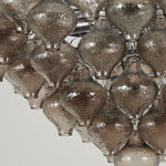 Vespera Tiered Smoked Glass Chandelier | Textured Smoked Glass | Detailed macro perspective focusing on the unlit textured glass drop components and hooks | Severn Lighting