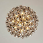 Vespera Tiered Smoked Glass Chandelier | Textured Smoked Glass | Directly underneath view displaying the glowing concentric pattern of the teardrop glass layers | Severn Lighting