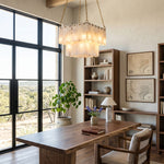Vivienne Tiered Alabaster Chandelier | Alabaster, Brass | Installed as an elegant statement light over a long solid wood study desk in a refined home library office room | Severn Lighting