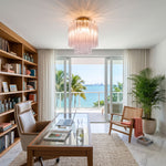 Amabel Dazzling Pink Glass Ceiling Light | Pink Glass and Brass | Installed in a bright home office with wooden desk and ocean view | Severn Lighting