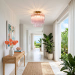 Amabel Dazzling Pink Glass Ceiling Light | Pink Glass and Brass | Displayed in a white hallway corridor above a console table and vase | Severn Lighting