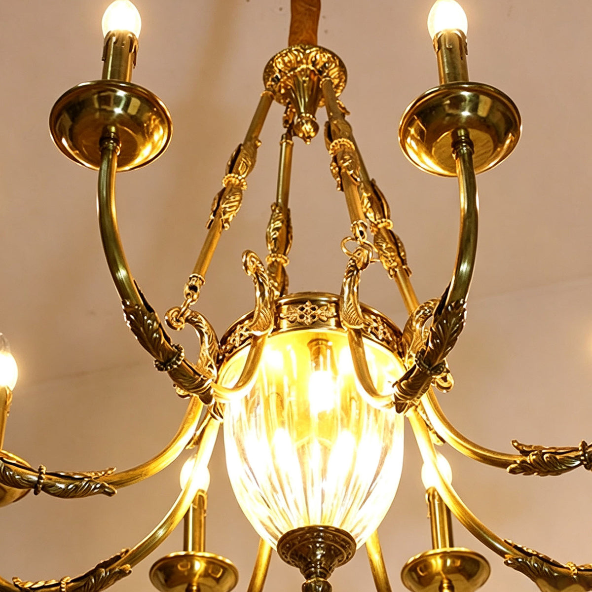 Anders Fluted Glass Urn Brass Chandelier | Fluted Glass and Brass | Bottom-up perspective view of the glowing center glass urn and brass arms | Severn Lighting
