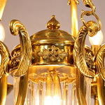 Anders Fluted Glass Urn Brass Chandelier | Fluted Glass and Brass | Macro detail showing the ornate carved brass cap atop the fluted glass urn | Severn Lighting