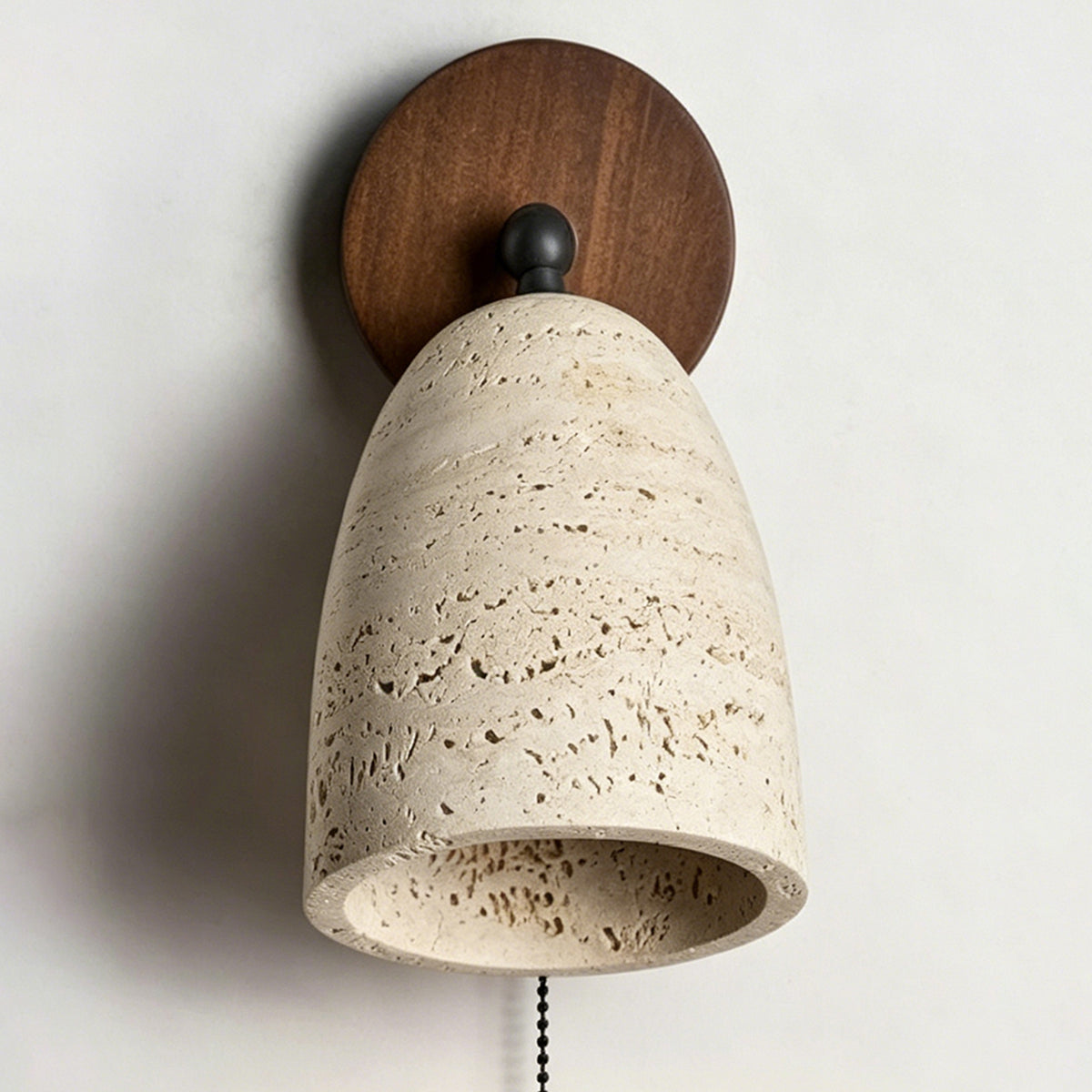 Aria Travertine Wood Wall Lamp | Travertine, Wood, Metal | Straight-on frontal view of the travertine stone wall sconce on a clean studio grey background | Isolated shot | Samu Lamp