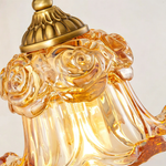 Armelle Rose Glass Brass Wall Lamp | Glass, Ceramic and Brass | Close-up view of the amber bell glass shade and brass crown | Severn Lighting