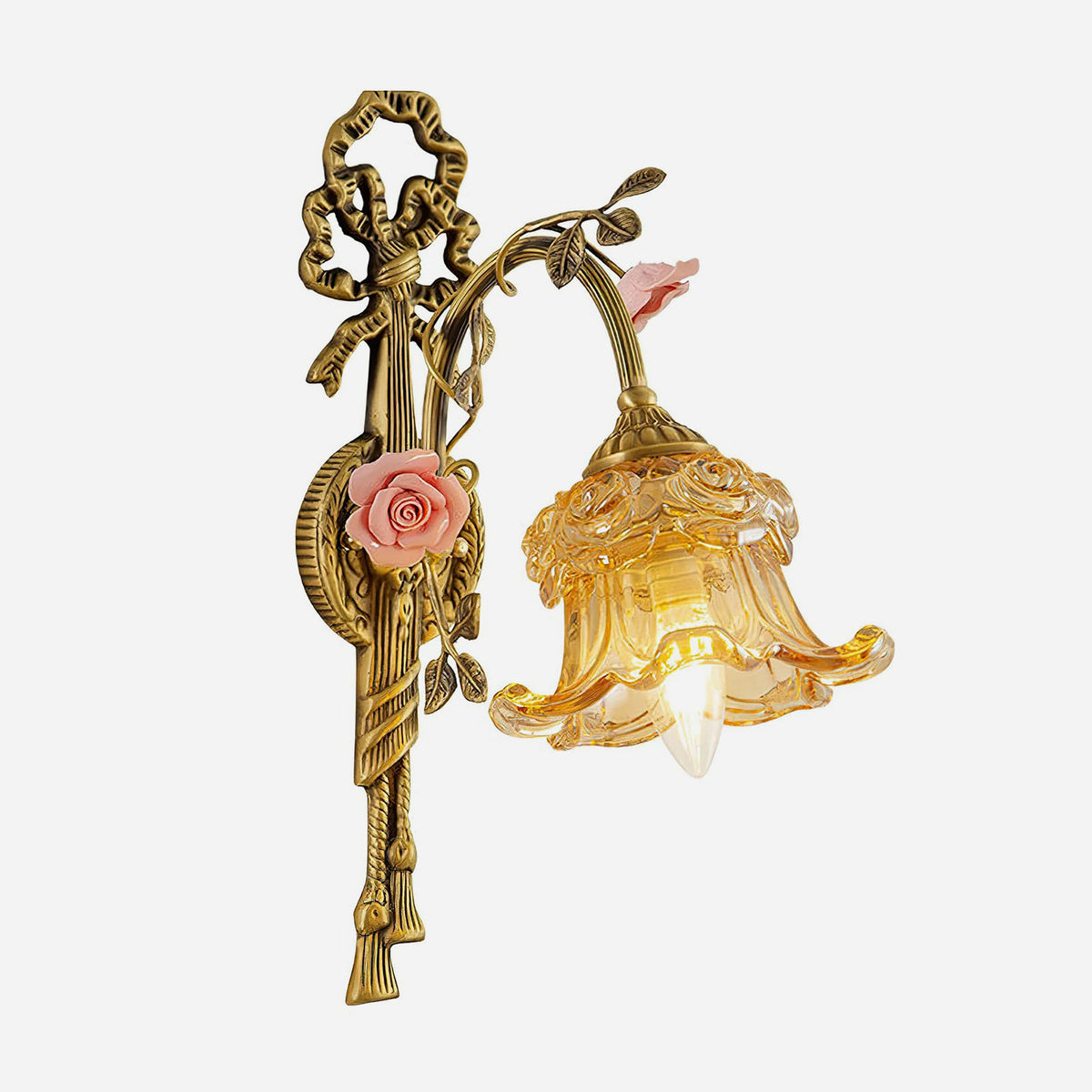 Armelle Rose Glass Brass Wall Lamp | Glass, Ceramic and Brass | Displayed illuminated against a rustic grey concrete wall | Severn Lighting