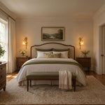 Armelle Rose Glass Brass Wall Lamp | Glass, Ceramic and Brass | Pair of sconces flanking a bed in a warm classic bedroom | Severn Lighting
