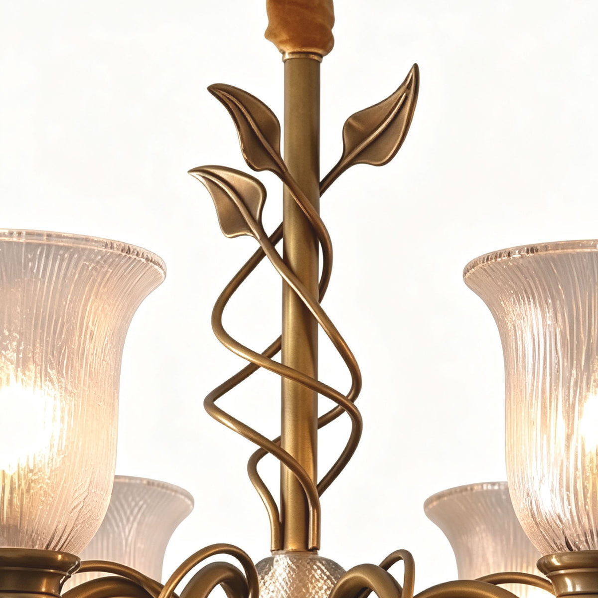 Auberon Ribbed Glass Vine Brass Chandelier | Ribbed Glass and Brass | Close-up detail showing the central column wrapped with brass vine and leaves | Severn Lighting