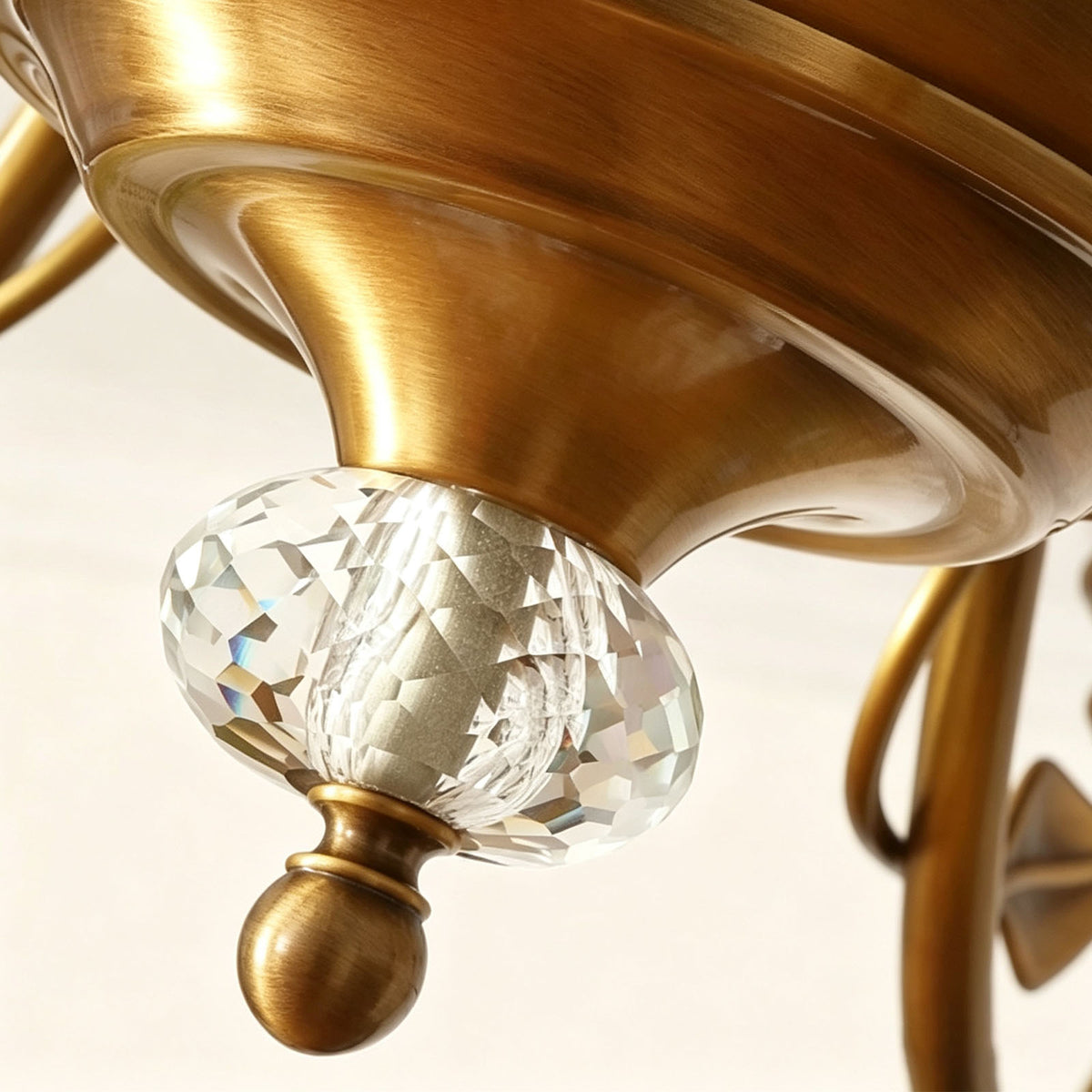 Auberon Ribbed Glass Vine Brass Chandelier | Ribbed Glass and Brass | Close-up view of the faceted clear crystal sphere finial at the bottom | Severn Lighting