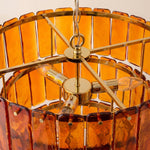Aurelia Tiered Amber Glass Chandelier | Glass, Metal | Top-down internal view showing the gold brass radial frame spokes, central connector, and the hanging mechanism of the amber glass tiles | Detail shot | Severn Lighting
