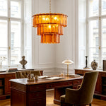 Aurelia Tiered Amber Glass Chandelier | Glass, Metal | Serving as a striking statement fixture in a traditional home library office above a dark wood executive desk and green armchair | Severn Lighting
