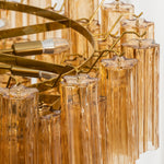 Auriane Fluted Amber Glass Chandelier | Fluted Amber Glass and Brass | Close-up view of amber glass rods mounted on the brass ring frame | Severn Lighting
