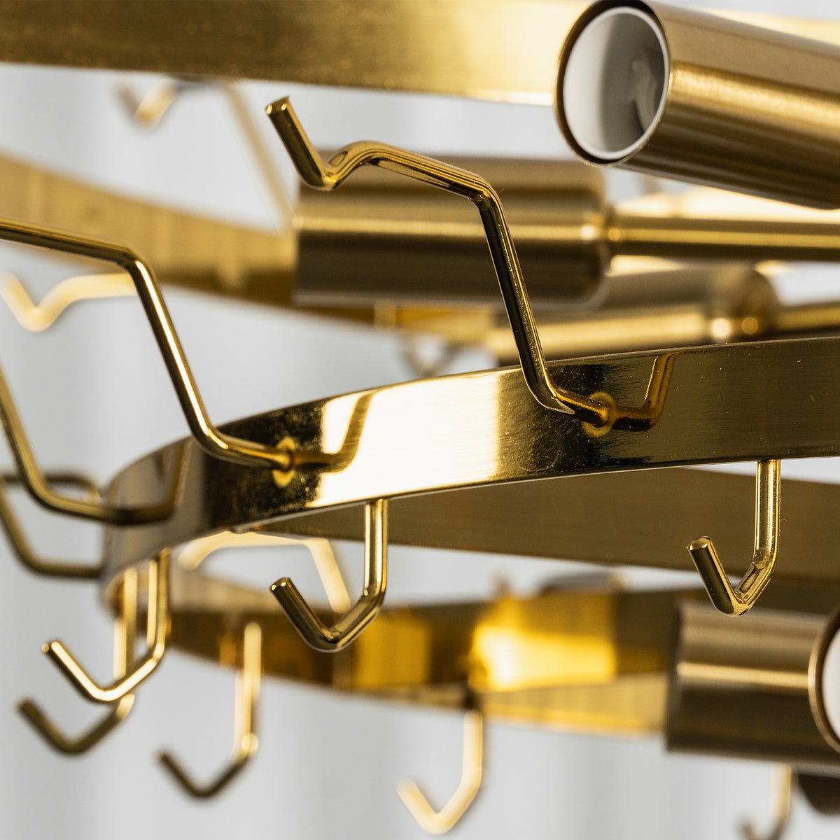 Auriane Fluted Amber Glass Chandelier | Fluted Amber Glass and Brass | Macro close-up of brass hardware frame hooks and inner structure | Severn Lighting
