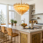 Auriane Fluted Amber Glass Chandelier | Fluted Amber Glass and Brass | Hanging above a modern kitchen island with bar stools | Severn Lighting