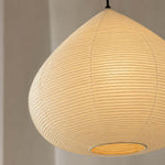 Bryony Teardrop Paper Pendant Light | Washi Paper and Metal | Angled side view of the illuminated teardrop paper shade | Severn Lighting