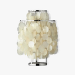 Callista Tiered Capiz Table Lamp | Capiz, Metal | Studio variant shot of the fully lit table lamp radiating a glowing warm halo against a pitch black background | Severn Lighting