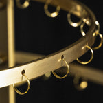 Callista Tiered Capiz Table Lamp | Capiz, Metal | Close-up detail view of the empty gold brass metal framework bands highlighting the evenly spaced wire attachment loops | Detail shot | Severn Lighting