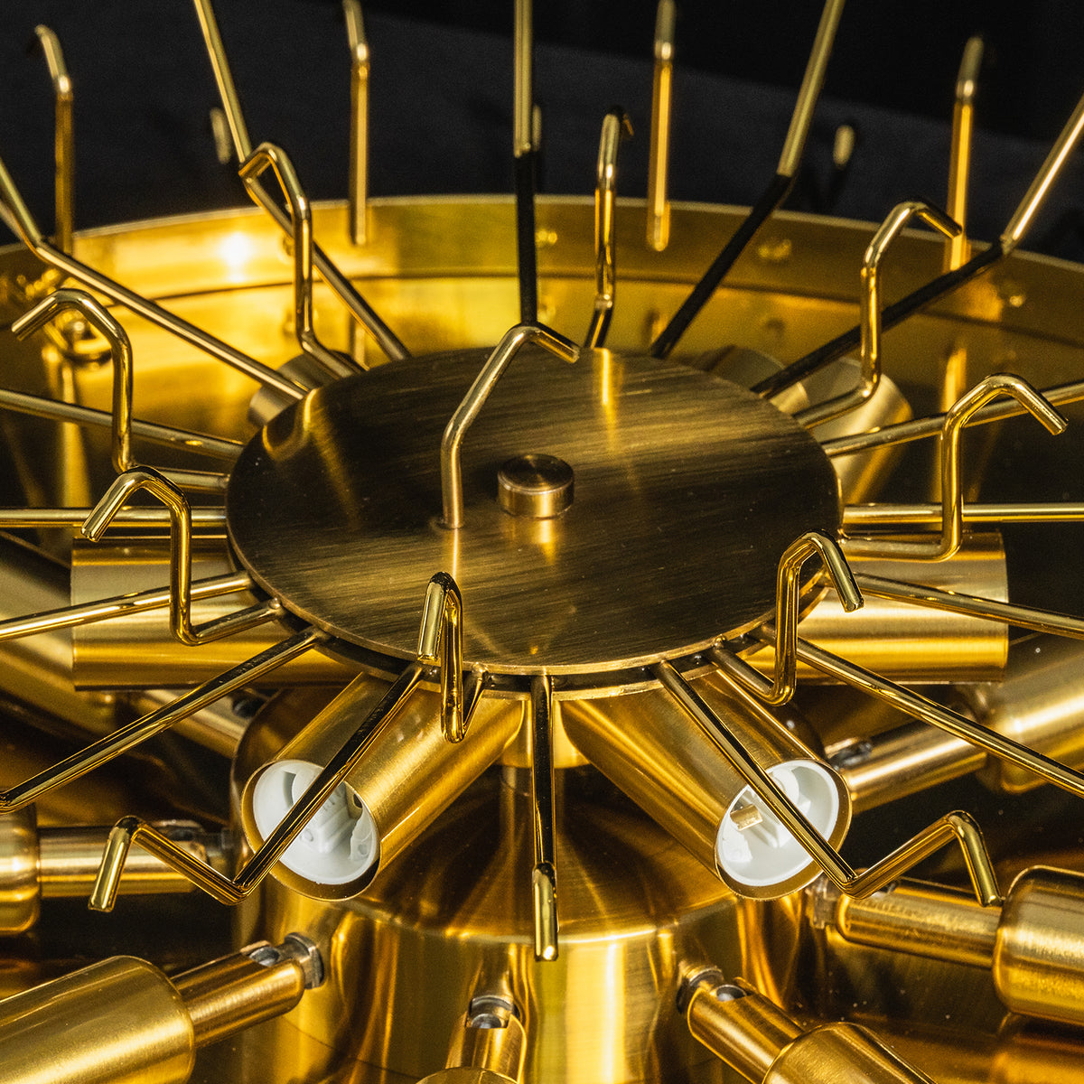 Cassian Tiered Fluted Glass Ceiling Light | Tiered Fluted Glass and Gold Brass | Detailed macro shot looking into the internal gold brass framework and multi-bulb socket hardware | Severn Lighting