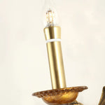 Clemency Winged Figure Brass Sconce | Cast Brass and Glass | Close-up detail of the candle sleeve and brass bobeche dish | Severn Lighting