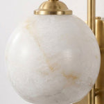 Cordelia Alabaster Globe Wall Sconce | Natural Alabaster and Brushed Brass | Close-up macro shot displaying the organic marble-like veins of the natural stone orb shade | Severn Lighting