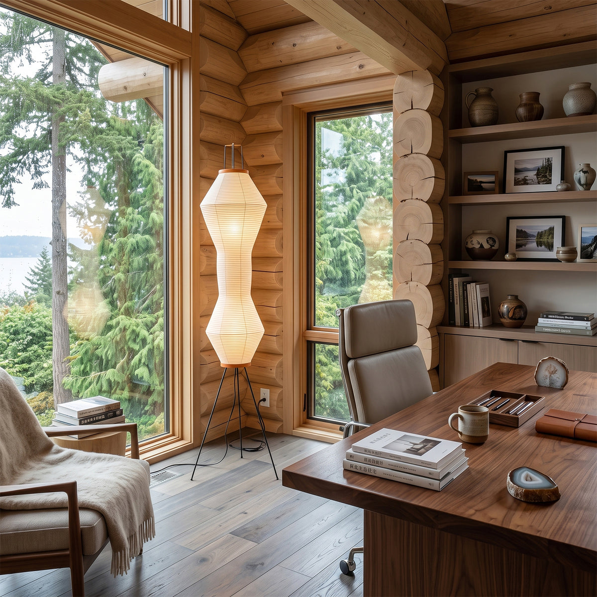 Cosima Hourglass Washi Paper Floor Lamp | Japanese Wabi-Sabi Paper and Black Tripod | Illuminating a rustic log cabin home office workspace with a wooden executive desk | Severn Lighting